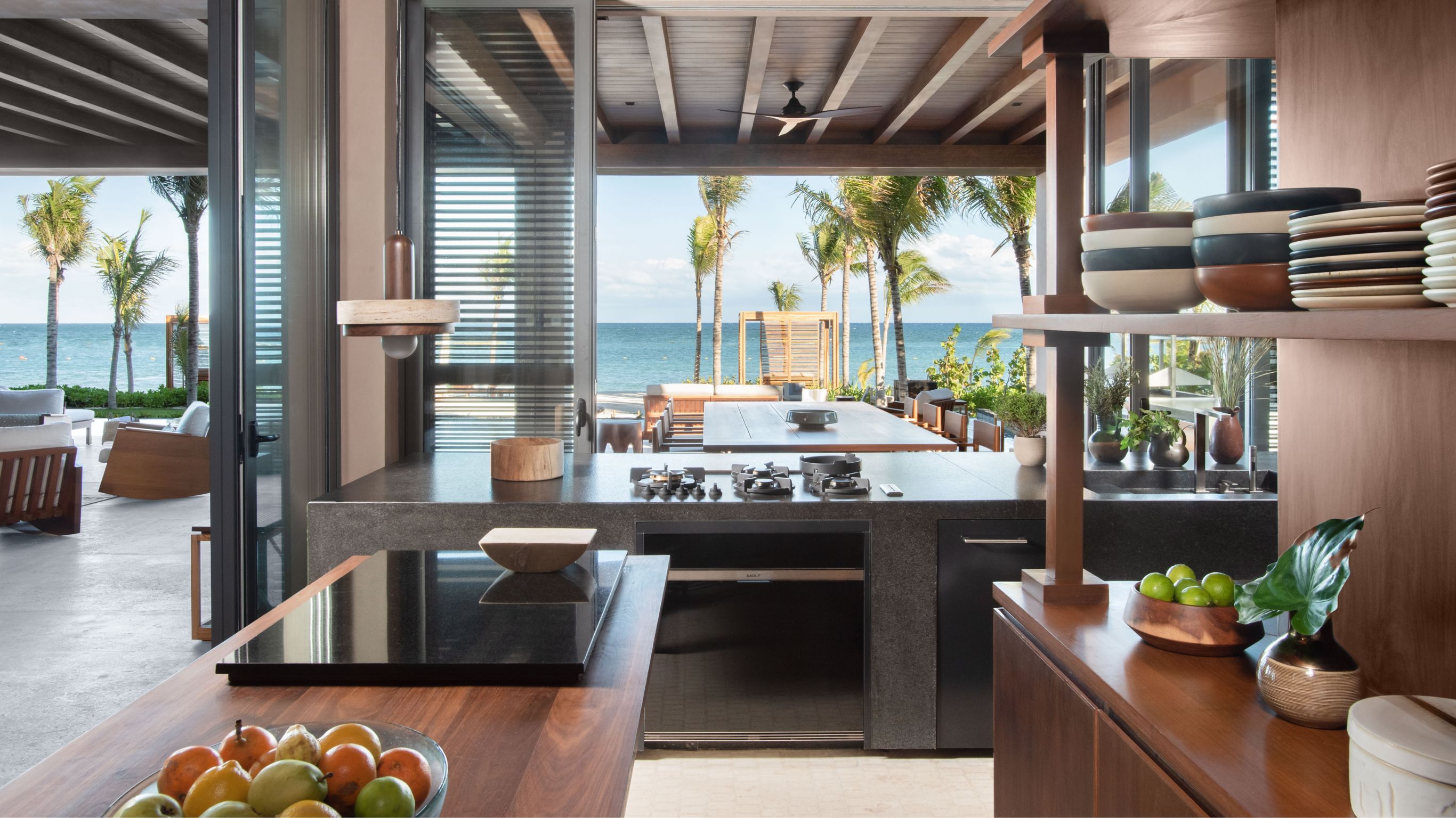 Beachfront Villa_full kitchen with open air concept and views out to terrace and ocean